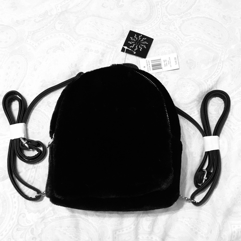 New soft black small to med. backpack strap purse.